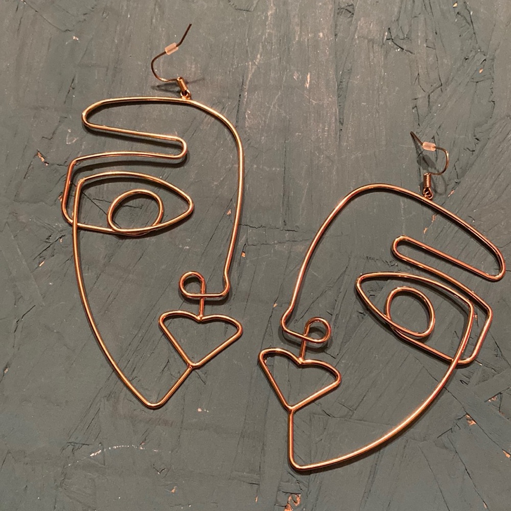 Large Pierced statement earrings wire shaped face